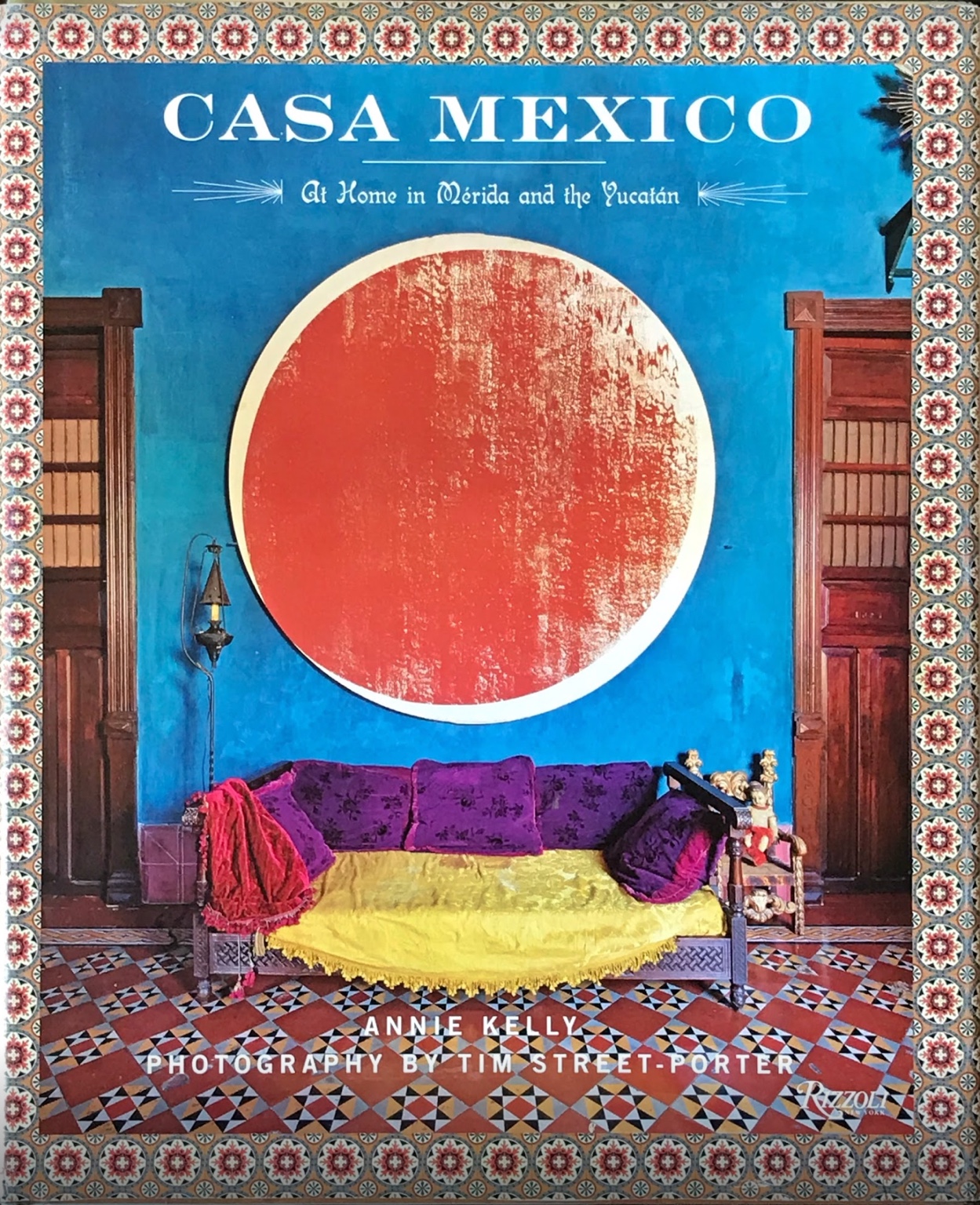Cover of Casa Mexico: At Home in Mérida and the Yucatán by Annie Kelly, showing an artwork by Michael Heizer in a vividly colored room